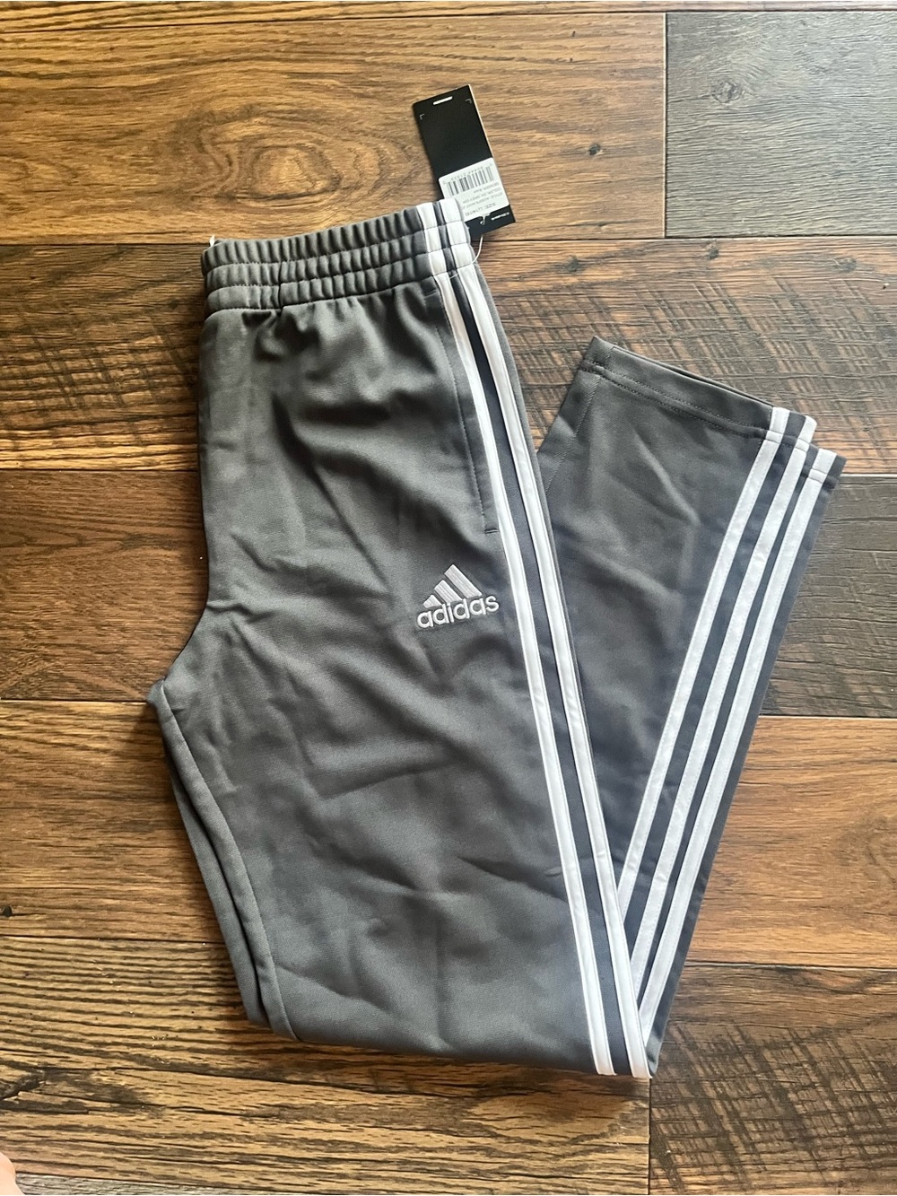 adidas Gray Track Pants with White Three-Stripes.